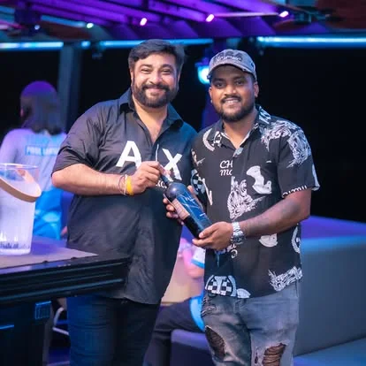 Guests with drinks at a Black Cruise Pattaya party night
